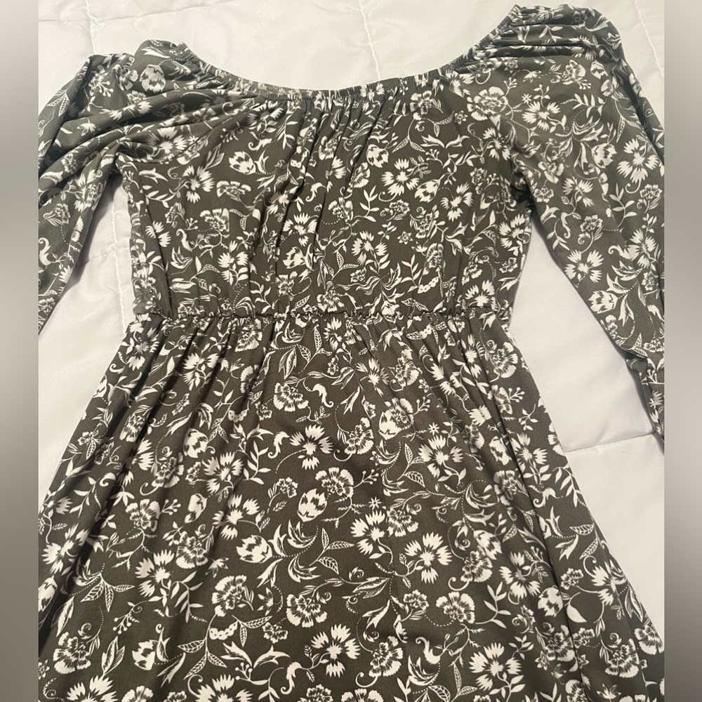Green dress with flowers on it. Never worn. Girls size large
